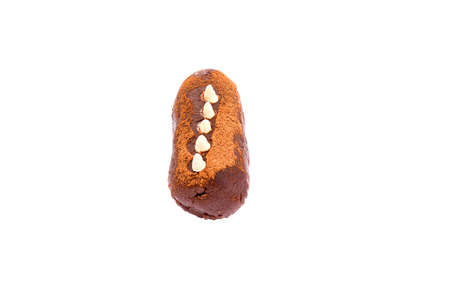Pastry sweet cake made of biscuits with cocoa powder and rum decorated with cream isolated tonedの写真素材