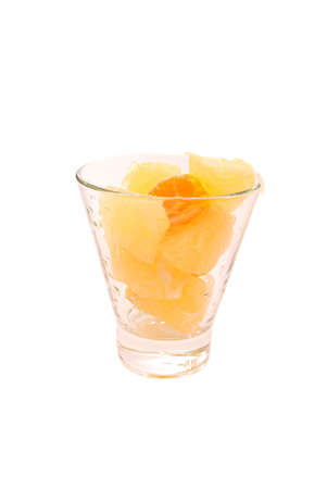 Pomelo and tangerine slices citrus in glass with water drops isolated tonedの写真素材