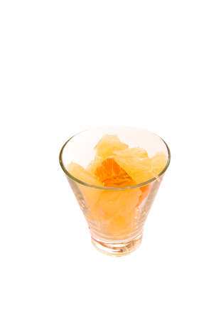 Pomelo and tangerine slices citrus in glass with water drops isolated tonedの写真素材