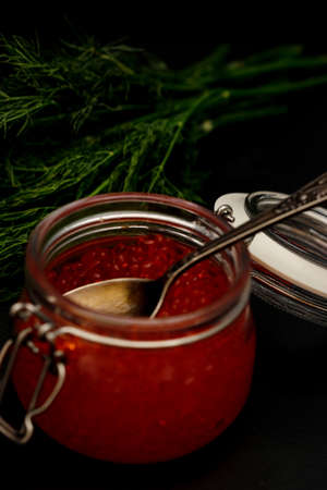 Fresh red caviar selective focus darkの写真素材