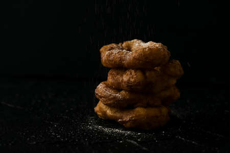 Freshly baked donuts with sugar powderの写真素材