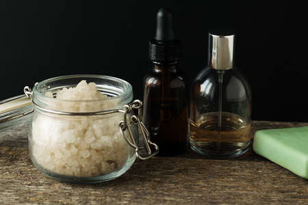 Bathroom accessories soap oils sea salt lavender aroma sachet on wooden desk toned selective focusの写真素材