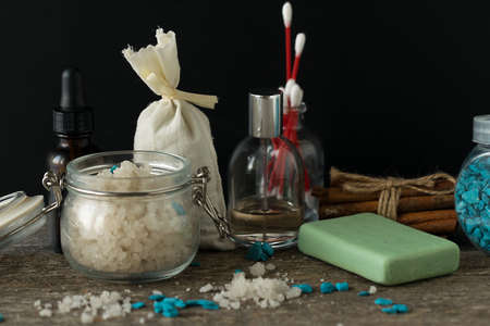 Bathroom accessories soap oils sea salt lavender aroma sachet on wooden desk toned selective focusの写真素材