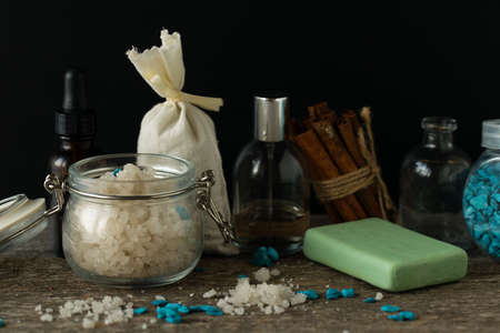 Bathroom accessories soap oils sea salt lavender aroma sachet on wooden desk toned selective focusの写真素材