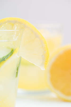 Sassy detox water with lemons, cucumbers and ginger. Healthy breakfast.の写真素材