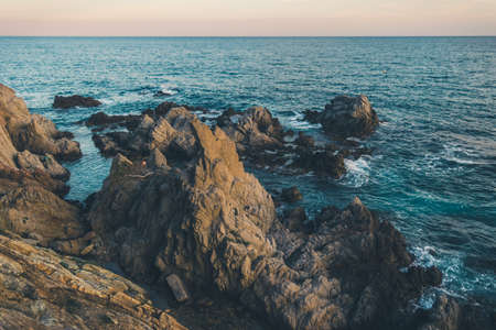 Lloret de mar city views. Spain Costa Brava holidays. Sunset in summer. Sandy beach. Toned photo.の写真素材