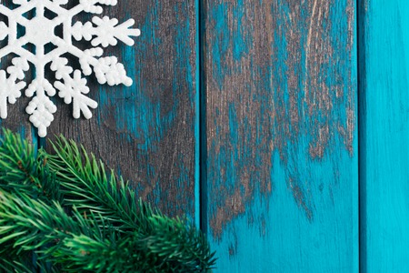 Snowflake christmas tree toy on wooden rustic desk. Christmas decoration. Vintage style christmas.の写真素材