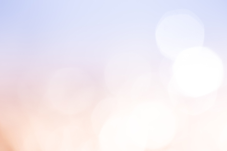 Peach and light blue bokeh lights abstract background.
