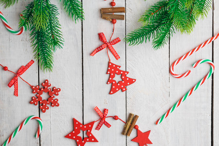 Christmas decorations on white wooden desk. Flat lay space for text.の写真素材