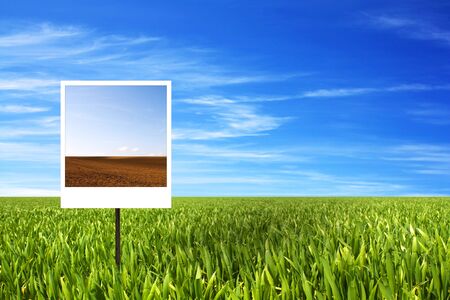 warming concept with a dry field on a picture at a green field