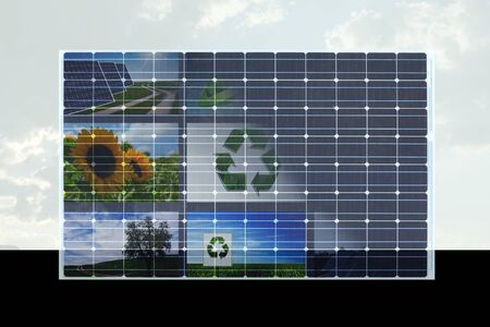 solar cell with natural symbols on it against cloudy skyの写真素材