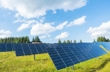 Sun energy production with photovoltaic panels on meadow