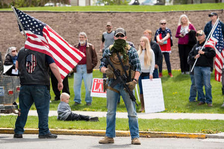 Helena, Montana - May 20, 2020: An armed man, militia member, protest at the Capitol building,...