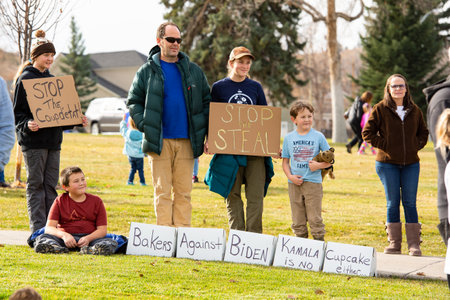 Helena, Montana / Nov 7, 2020: Protesters at 'Stop the Steal' rally, children holding signs president elect Joe Biden and Kamala Harris, election was stolen from Donald Trump due to election fraudのeditorial素材