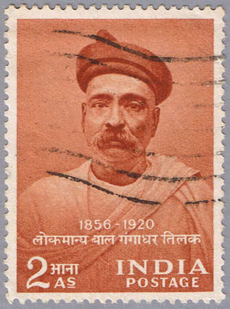 INDIA - CIRCA 1956: A stamp printed in India shows a portrait of the Indian independence leader Bal Gangadhar Tilak, circa 1956の写真素材