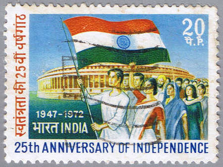 INDIA - CIRCA 1972: A stamp printed in India shows marchers with flag, circa 1972の写真素材