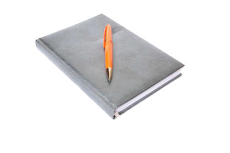 The diary and pen on a white backgroundの写真素材