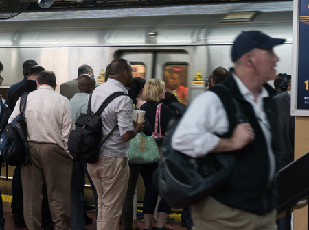 New York City, Circa 2017: Manhattan commuters wait for Long Island Railroad LIRR train to arrive at Penn Station underground transit terminalのeditorial素材