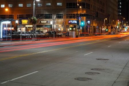 Minneapolis Minnesota - November 2016: Light trails from cars at night traveling through downtown MN past the financial district and restaurant row.のeditorial素材