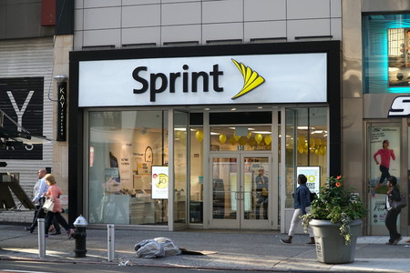 New York City - September 2016: People walk past Sprint store in Manhattan. Mobile phone cellular...