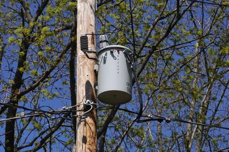 Long Island, NY - April 3, 2016: A PSEG electric transformer sits on a utility pole serving power...