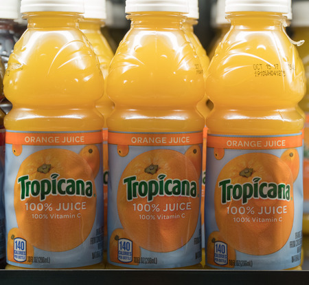New York City, Circa 2017: Tropicana Orange Juice bottles on grocery store market display shelf for customer purchase. 100% juice healthy vitamin C immune system support. Illustrative editorialのeditorial素材