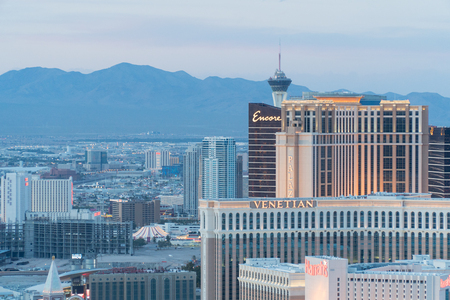 Las Vegas, USA - Circa 2017: Aerial view of hotel casino row on strip at sunset. Encore Venetian Harrahs resort. Stratosphere and mountains in background at dusk colors.のeditorial素材