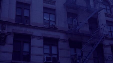 Night time exterior establishing shot outside a typical generic urban city style apartment building....