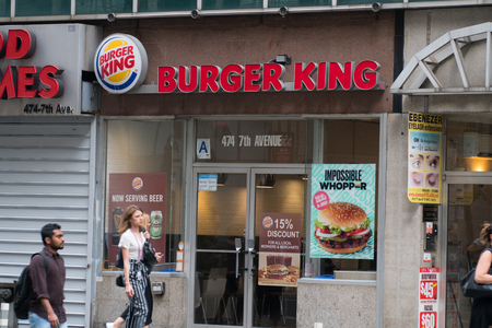 New York City - Circa 2019: Burger King fast food hamburger chain restaurant along Manhattan street. Home of the famous whopper sandwich flame broiled beef patties.のeditorial素材
