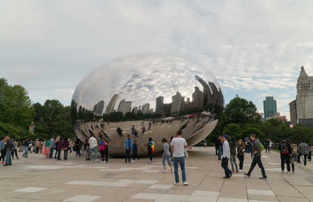 Chicago, USA - Circa 2019: Famous cloud gate art sculpture in downtown park made of steel reflecting cityscape skyline on Chicago beanのeditorial素材