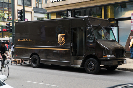 Chicago, USA - Circa 2019: United Parcel Service UPS famous brown logo truck parked on city street deliver package to local business and residenceのeditorial素材