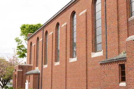 Generic establishing shot of side wall of typical church building or religious catholic school facadeの写真素材