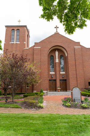 Generic church building exterior on beautiful spring day. Vertical view of front facadeの写真素材