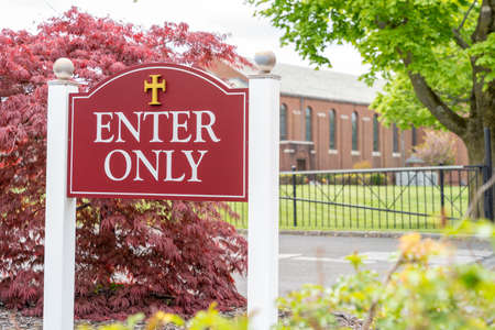 Generic Enter Only sign on church parking lot directing car traffic for security and safety purposeの写真素材