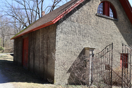 Old house with red roof in a village in the spring.の写真素材