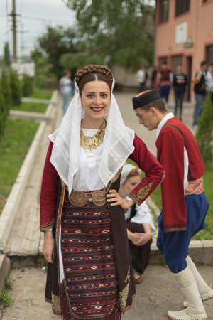 Pozarevac, Serbia-May 2, 2016: Girl in   serbian folk  costume  smiling  on  folk  music  festival in city called Pozarevac  on  springのeditorial素材