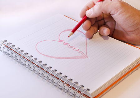 Red draw hart on white paperの写真素材