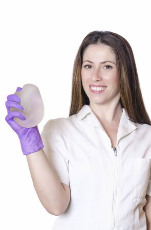 Silicone breast implants. Nurse holding implants. Doctor holding implants. Plastic surgeryの写真素材