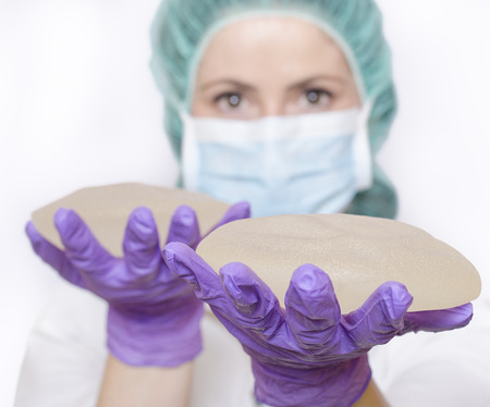 Silicone breast implants. Nurse holding implants. Doctor holding implants. Plastic surgeryの写真素材