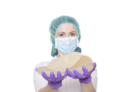Silicone breast implants. Nurse holding implants. Doctor holding implants. Plastic surgeryの写真素材
