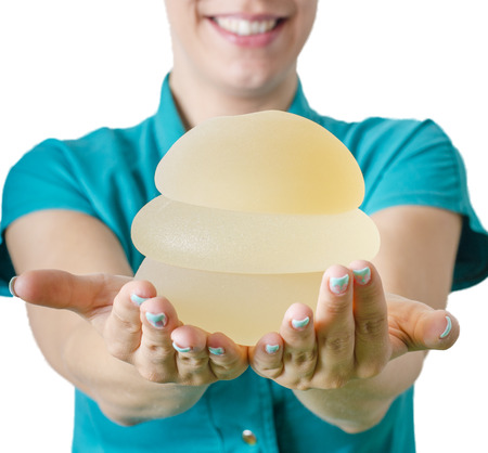 Silicone breast implant. Doctor hold silicone breast prothesis.の写真素材