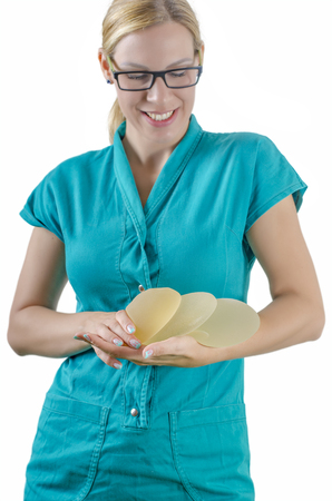 Silicone breast implant. Doctor hold silicone breast prothesis.の写真素材