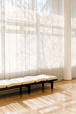 white striped curtains in the waiting room, note shallow depth of fieldのeditorial素材
