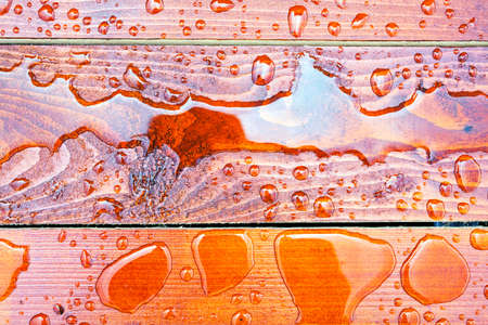 Abstract raindrops pattern on wooden floorの写真素材