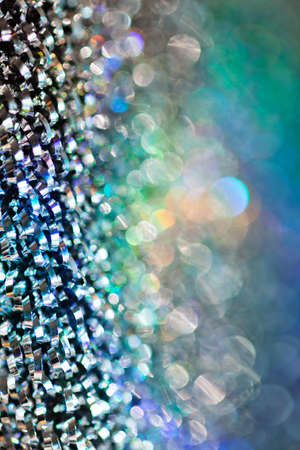 reflections of light multi color on the rough metal surface, for blurred background