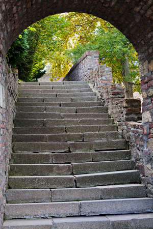 Old amazing stone stairs with a gate at a topの写真素材