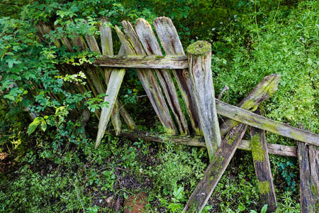 broken fence from wooden planks, note shallow depth of fieldの写真素材