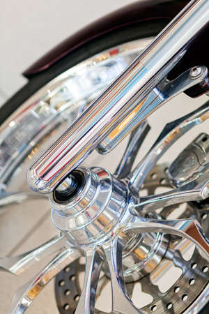 The front tire of a parked motorcycleの写真素材