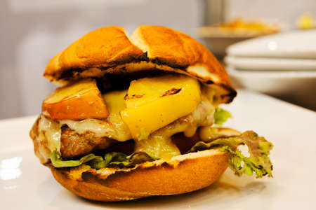 Big sandwich - hamburger with beef burger, cheese and tomatoの写真素材