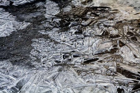 Froozen puddle on winter morningの写真素材